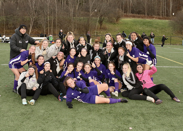 The+state+champion+girls+soccer+team+poses+after+their+victory.+