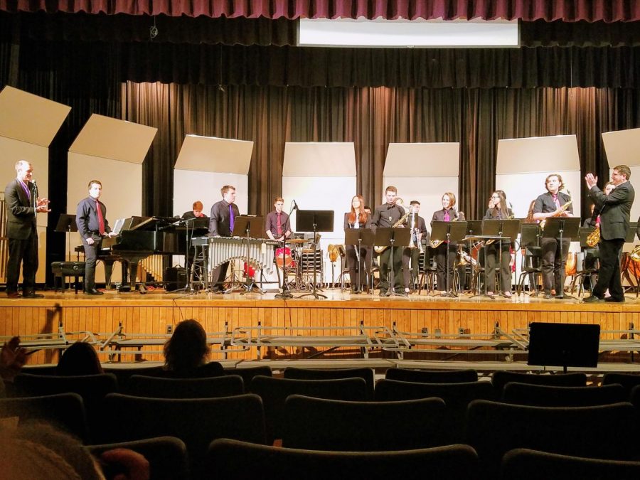 Jazz ensemble gets acknowledged after they finish the last piece of the concert