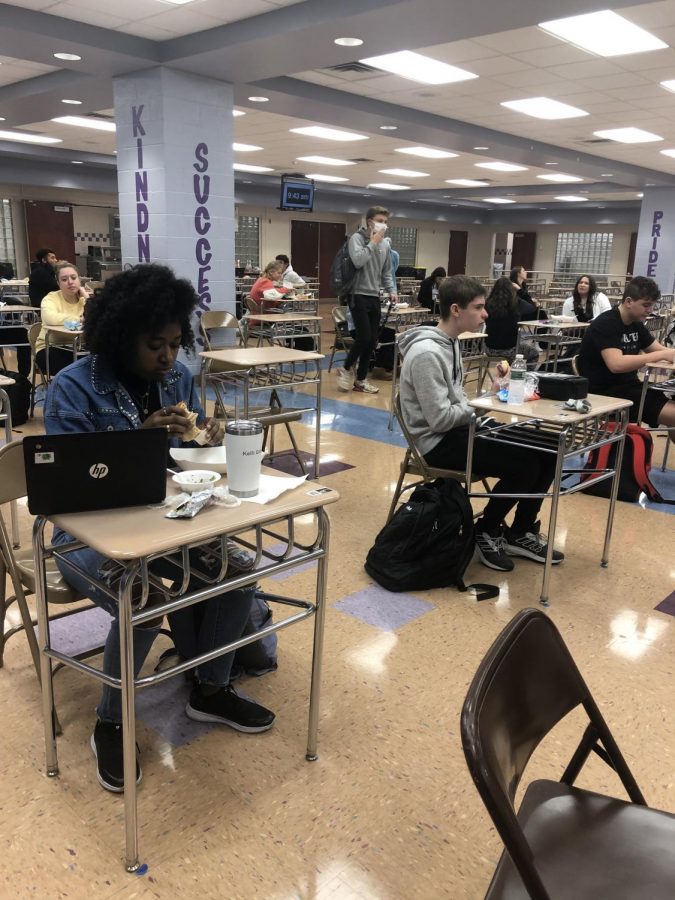 Students eat lunch at their desks following CDC social distancing guidelines. Students have been living with covid restrictions for over a year now.