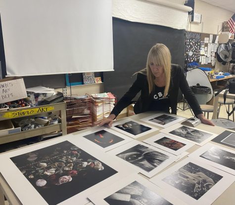 Ms. Gitto setting up for student art critiques for her photography class.
