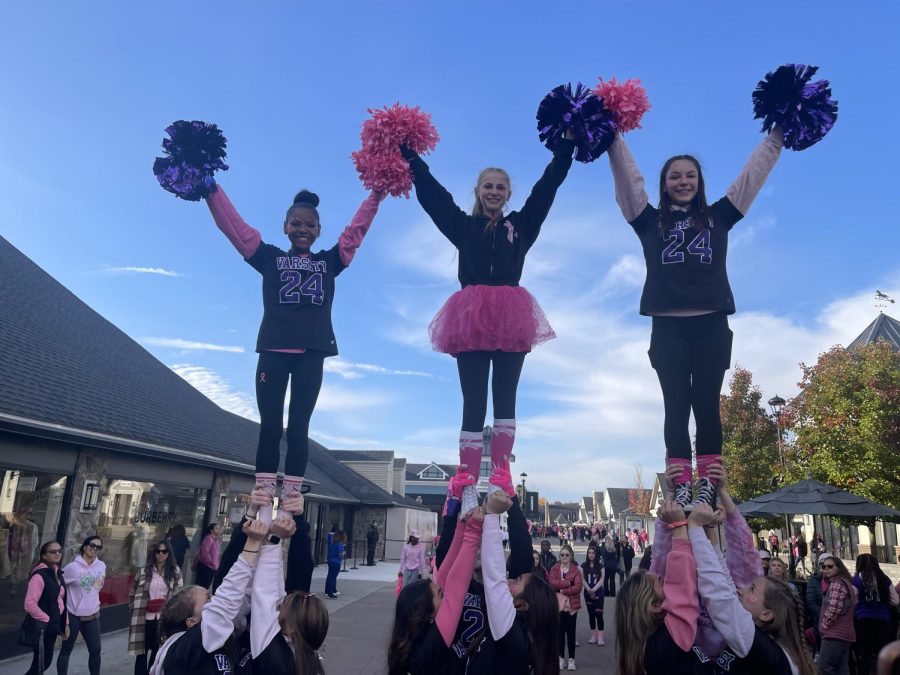 Monroe - Woodbury Varsity Cheerleaders entertain the crowd before the walk begins. 