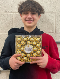 Freshman Travis Stuart has chocolates in his hand on February 14, 2023, for his girlfriend. 