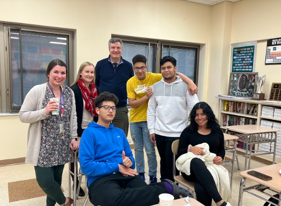 Some members of The Dreamer Community Club at a meeting with their advisors. 