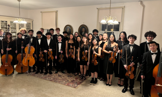 Monroe-Woodbury+High+Schools+Chamber+Orchestra+posing+before+their+performance.