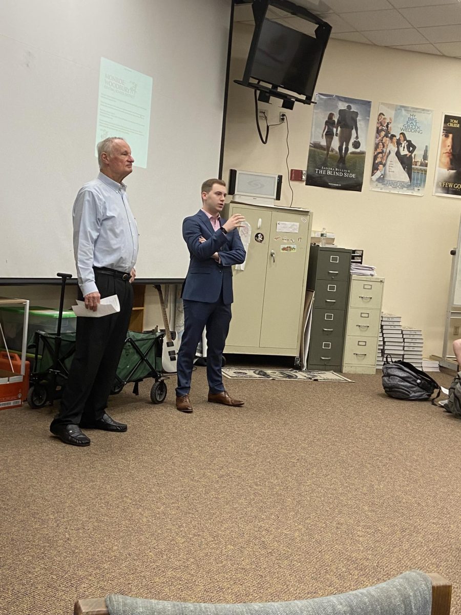 Chester Town Supervisor Brandon Holdridge and board member Larry Dysinger speak to high school students at a town hall meeting in April. 