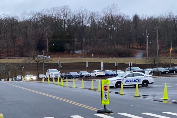 A parked police car outside of Monroe-Woodbury High School.