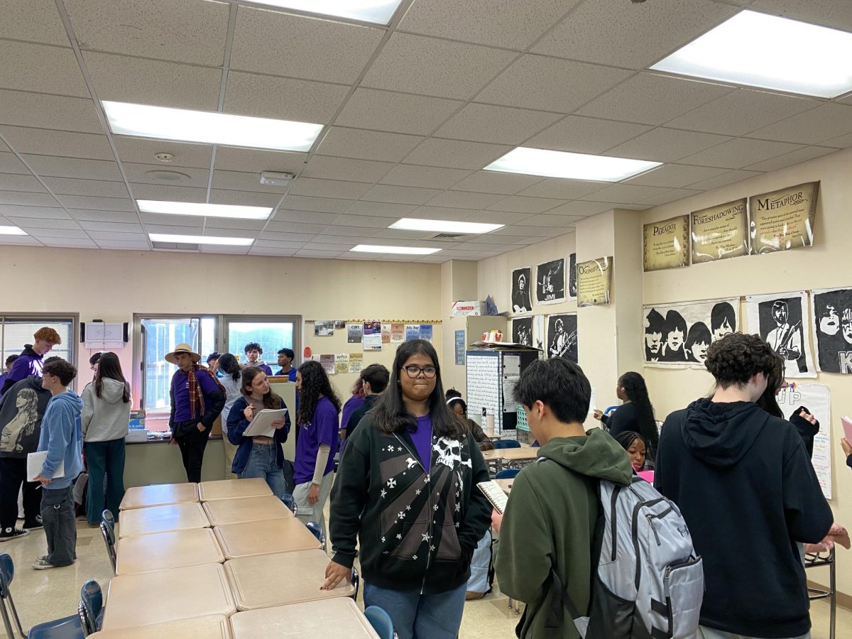 The Interact Club gathered on December 17 to donate holiday gifts for families before diving into pizza and chicken wings.