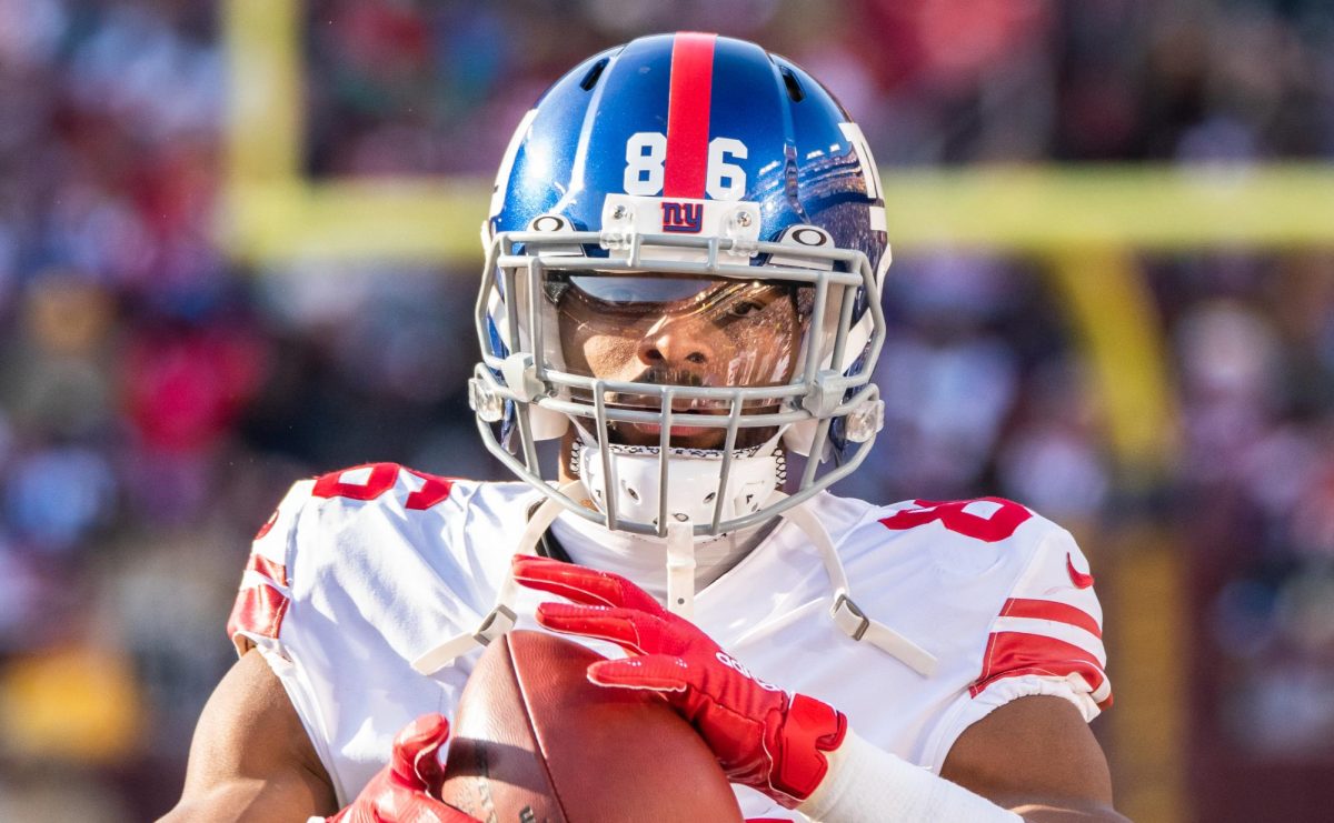 Darius Slayton, a New York Giants 
wide receiver whose contract will soon expire, holding the football during a game against the Washington Redskins on December 22, 2019.

Attribution: AlexanderJonesi, CC BY-SA 2.0 , via Wikimedia Commons