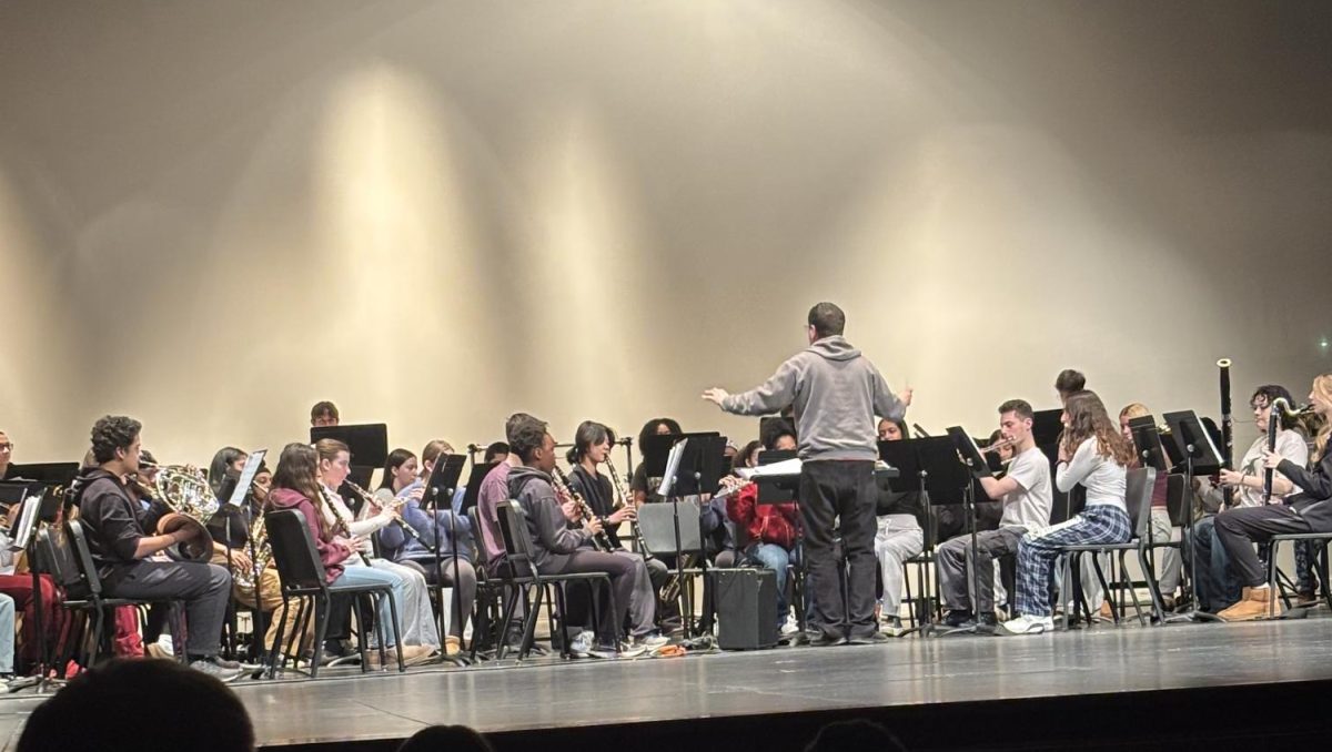 Mr. Petrocelli conducts a combined rehearsal the day of the Prism Concert, an opportunity for Monroe-Woodbury's musical groups to play together.