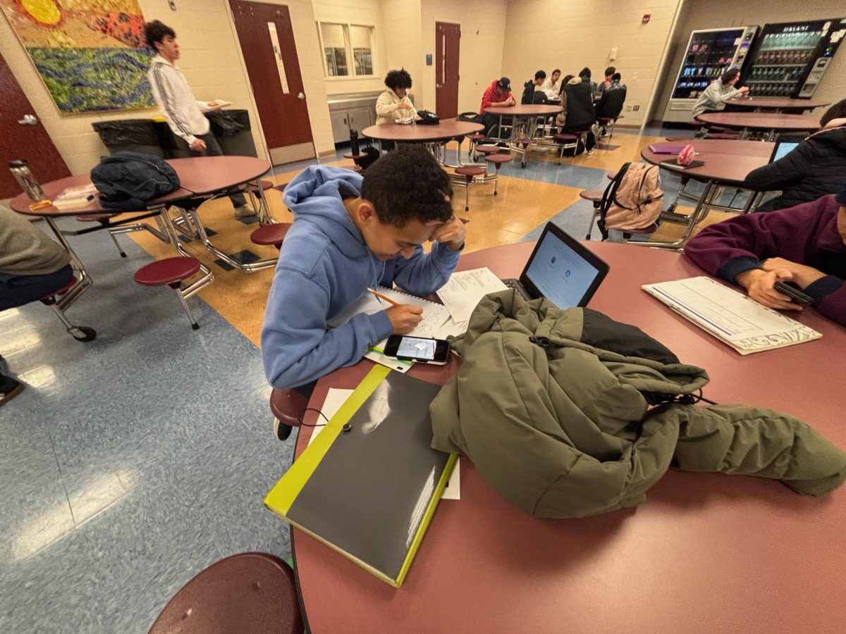 Mason Hernandez studying through lunch. 